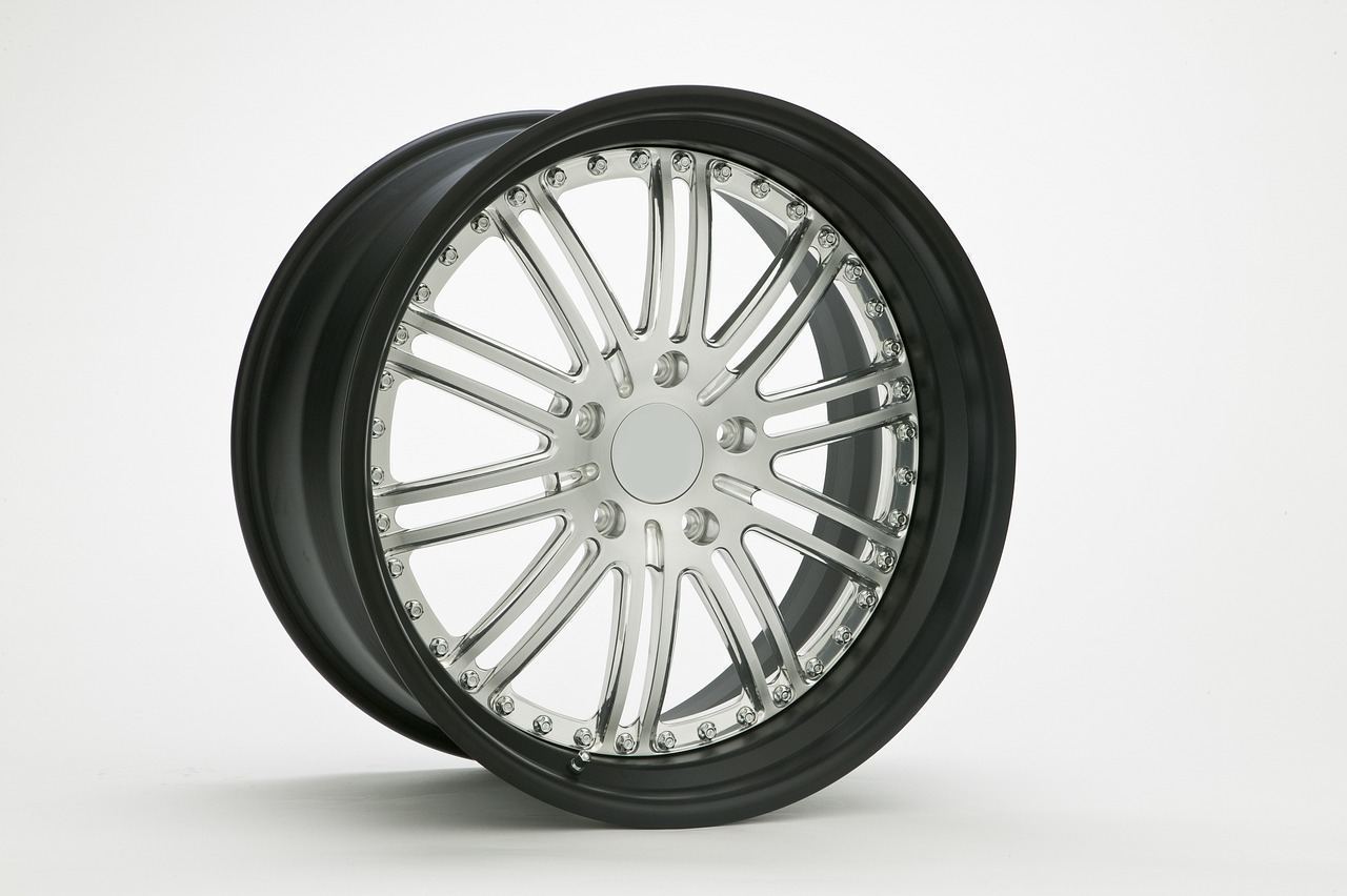 Roadside tire change on the highway shoulder near an exit ramp