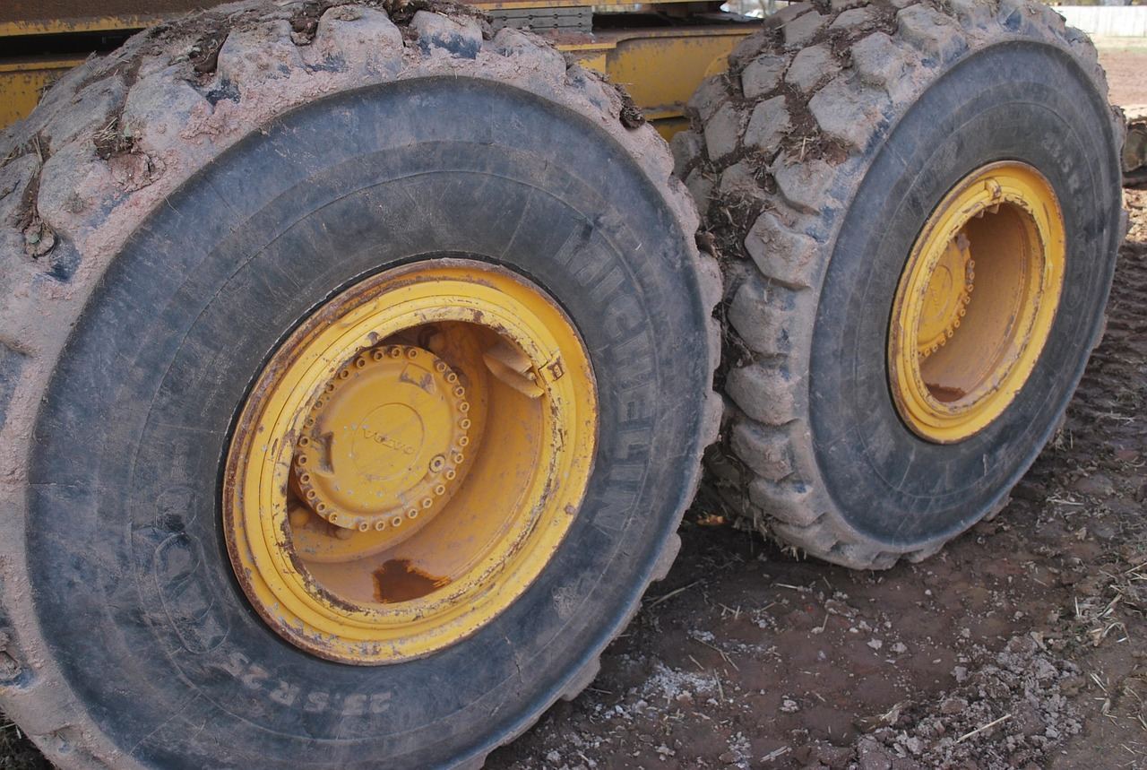 Spare tire wheel with lug nuts, ready for a roadside swap