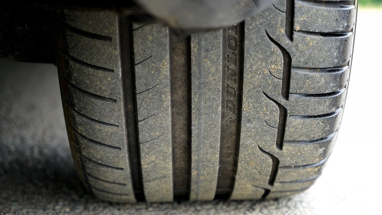 Car tire tread close-up on the road